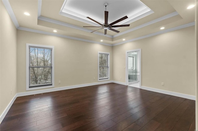 1661 Helmsdale Cpe, Girardeau, MO 63701 - spare room with a tray ceiling, a ceiling fan, crown molding, dark wood-style floors, and baseboards