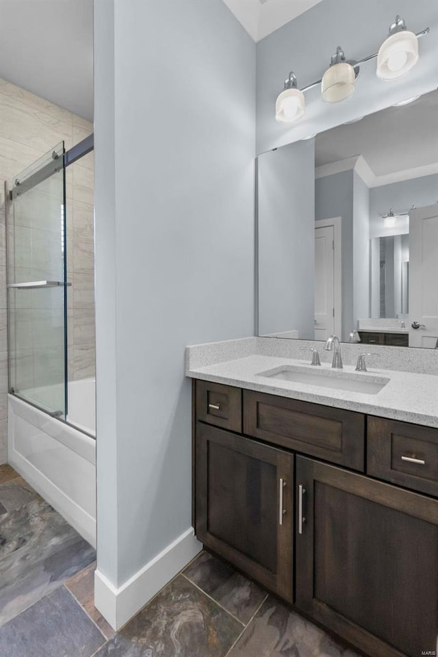 1661 Helmsdale Cpe, Girardeau, MO 63701 - full bathroom featuring combined bath / shower with glass door, vanity, baseboards, and ornamental molding