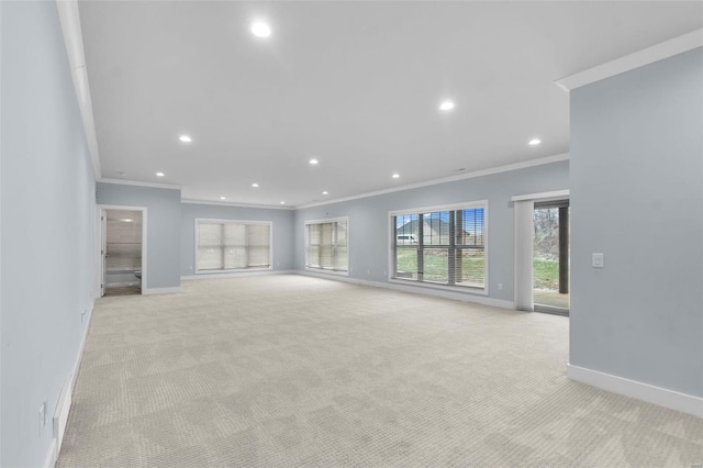 1661 Helmsdale Cpe, Girardeau, MO 63701 - unfurnished living room featuring crown molding, light carpet, baseboards, and recessed lighting