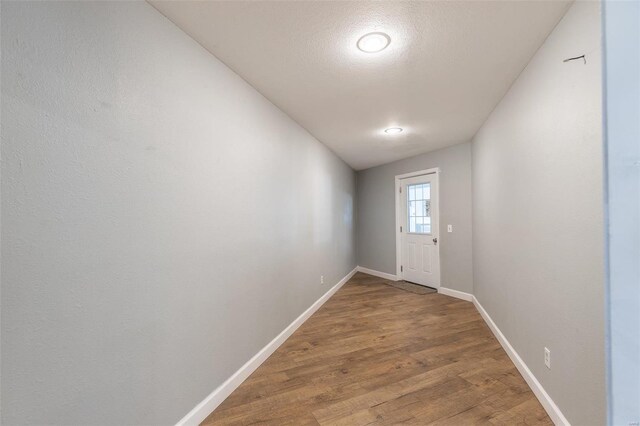 14178 E US Highway 60, Van Buren, MO 63965 - doorway to outside with baseboards, light wood finished floors, and a textured ceiling