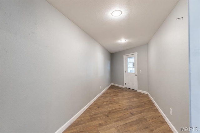 14178 E US Highway 60, Van Buren, MO 63965 - doorway to outside featuring wood finished floors, baseboards, and a textured ceiling
