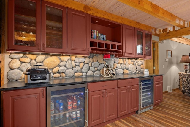 7467 Walshville Trl, Hillsboro, IL 62049 - indoor bar featuring wine cooler, tasteful backsplash, light wood-style flooring, beamed ceiling, and baseboards