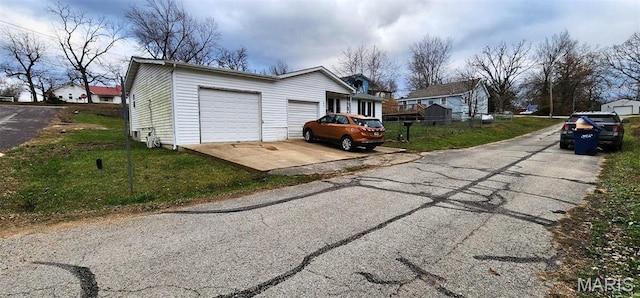 300 S Oak St, Salem, MO 65560 - view of home's exterior with a lawn, a garage, and driveway
