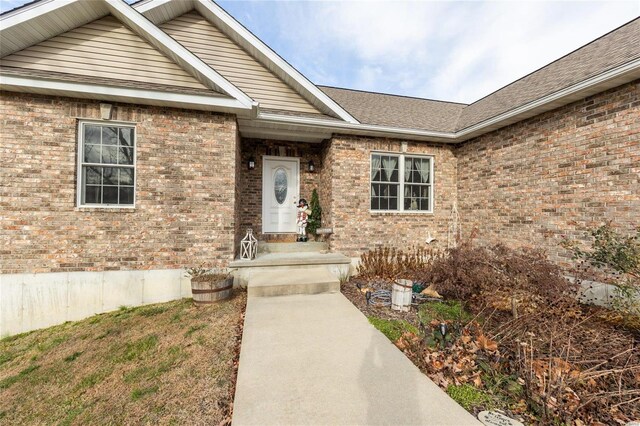 311 Dana Renee, Rolla, MO 65401 - view of exterior entry with brick siding and a shingled roof