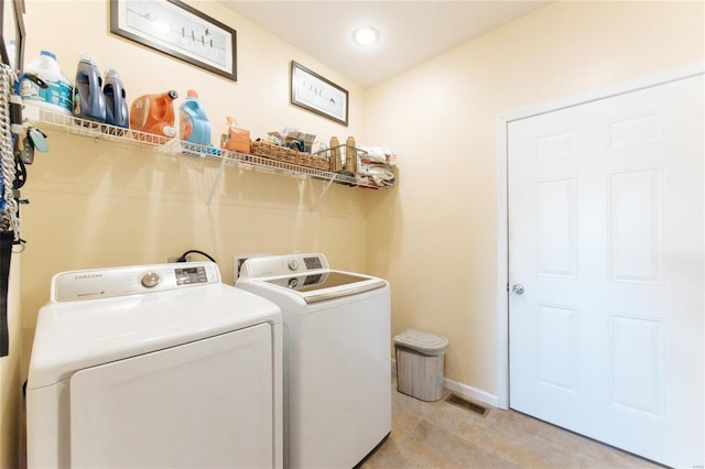 311 Dana Renee, Rolla, MO 65401 - laundry room with washer and clothes dryer, baseboards, and recessed lighting