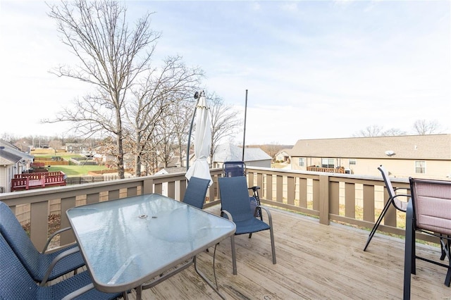 311 Dana Renee, Rolla, MO 65401 - wooden deck with outdoor dining space and a residential view