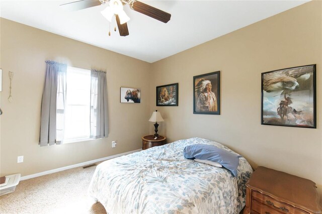 311 Dana Renee, Rolla, MO 65401 - bedroom featuring carpet floors, a ceiling fan, and baseboards