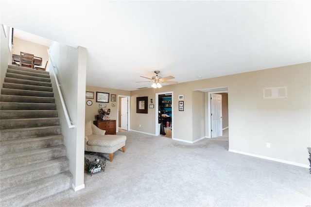 311 Dana Renee, Rolla, MO 65401 - carpeted living room with stairs, baseboards, and a ceiling fan