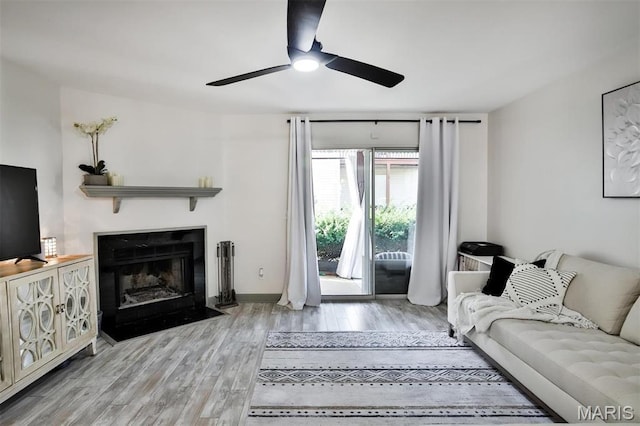 915 Sugar Lake Ct Unit 4, Saint Peters, MO 63376 - living room featuring a ceiling fan, wood finished floors, and a fireplace with flush hearth