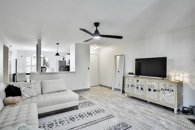 915 Sugar Lake Ct Unit 4, Saint Peters, MO 63376 - living area with ceiling fan, light wood-style flooring, and baseboards