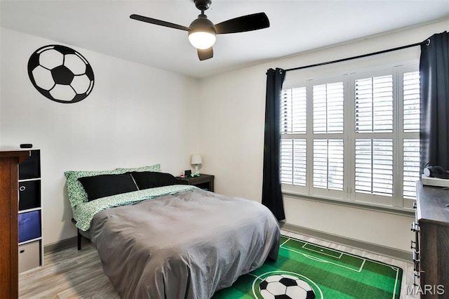 915 Sugar Lake Ct Unit 4, Saint Peters, MO 63376 - bedroom with wood finished floors, baseboards, and ceiling fan