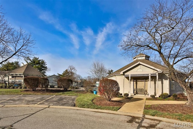 915 Sugar Lake Ct Unit 4, Saint Peters, MO 63376 - view of front of property with uncovered parking and a chimney