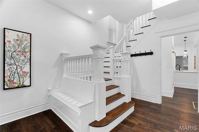 3223 Geyer Ave, Saint Louis, MO 63104 - stairs featuring wood finished floors, baseboards, and recessed lighting