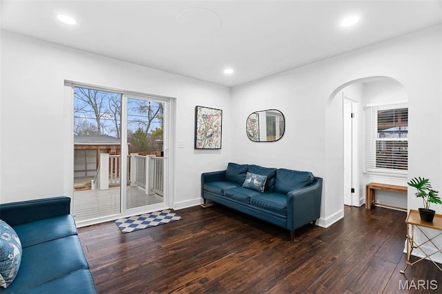 3223 Geyer Ave, Saint Louis, MO 63104 - living room with arched walkways, wood-type flooring, baseboards, and recessed lighting