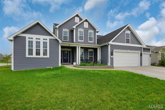 215 Wyndemere Ln, Lake St Louis, MO 63367 - view of front of house featuring driveway, a front yard, covered porch, and an attached garage