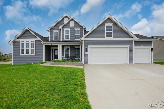 215 Wyndemere Ln, Lake St Louis, MO 63367 - view of front of property with a garage, concrete driveway, a front yard, and a porch