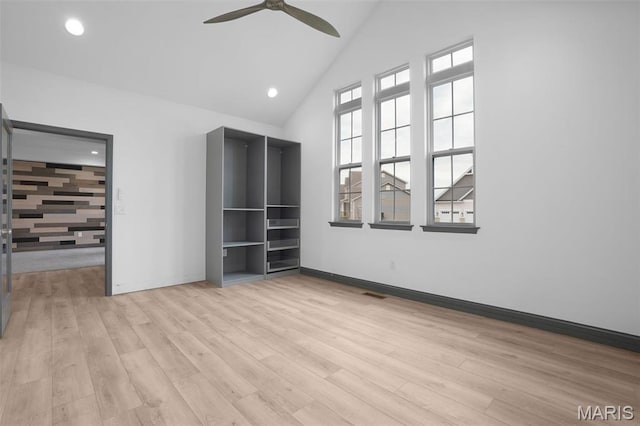215 Wyndemere Ln, Lake St Louis, MO 63367 - unfurnished bedroom featuring wood finished floors, baseboards, high vaulted ceiling, a ceiling fan, and recessed lighting