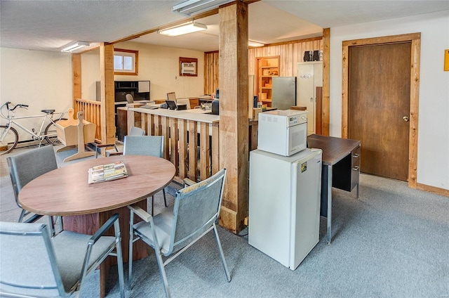 106 N Market St, Waterloo, IL 62298 - dining area featuring light colored carpet and baseboards