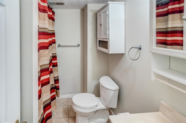 106 N Market St, Waterloo, IL 62298 - bathroom with toilet, a shower with shower curtain, and tile patterned flooring