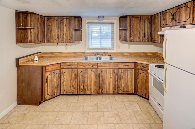106 N Market St, Waterloo, IL 62298 - kitchen with open shelves, white appliances, a sink, exhaust hood, and brown cabinets
