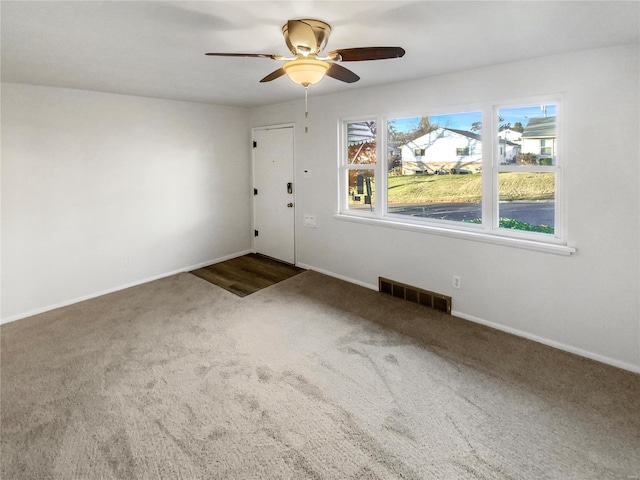 6448 Clifton Hills Dr, Saint Louis, MO 63139 - carpeted spare room with a ceiling fan and baseboards