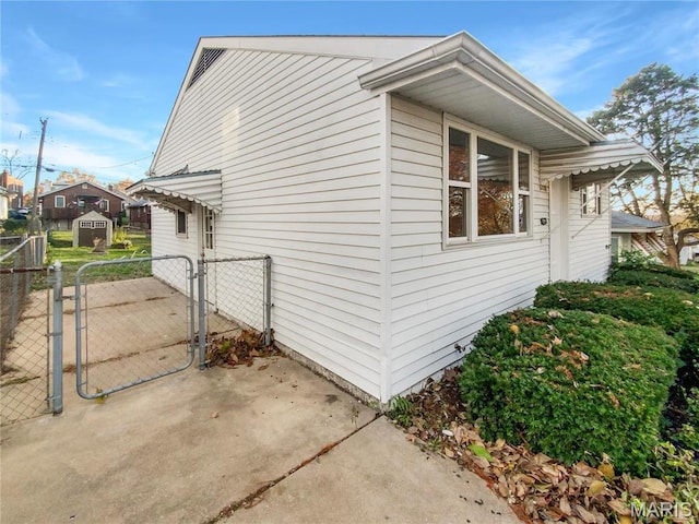 6448 Clifton Hills Dr, Saint Louis, MO 63139 - view of side of home featuring a gate