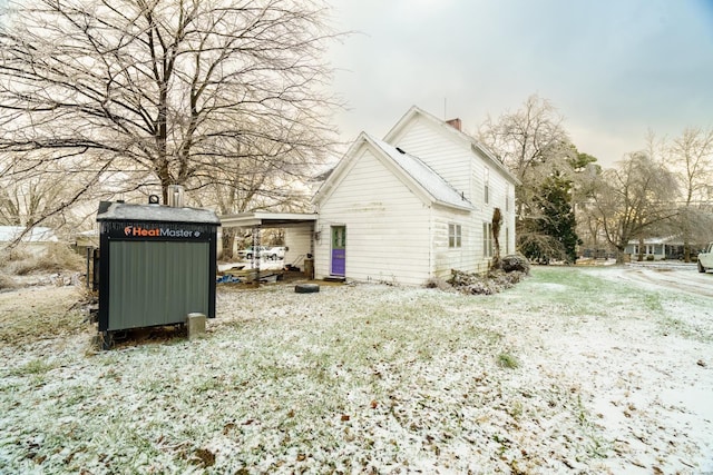 212 N Main St, Licking, MO 65542 - view of side of property with a chimney