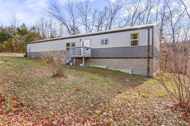 1740 Woodhill Dr, Lake Timberline, MO 63628 - manufactured / mobile home featuring a wooden deck and stairway