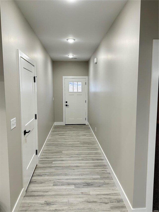 344 Rolling Knoll Rd, Washington, MO 63090 - doorway to outside with baseboards and light wood-style flooring