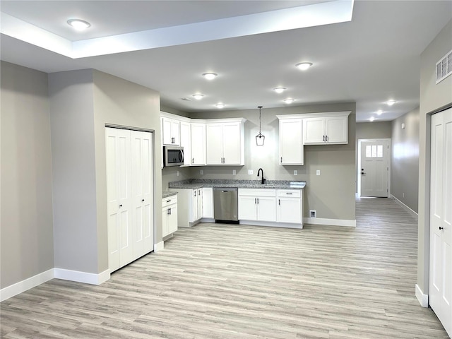 344 Rolling Knoll Rd, Washington, MO 63090 - kitchen with appliances with stainless steel finishes, baseboards, light wood-style floors, a sink, and white cabinetry