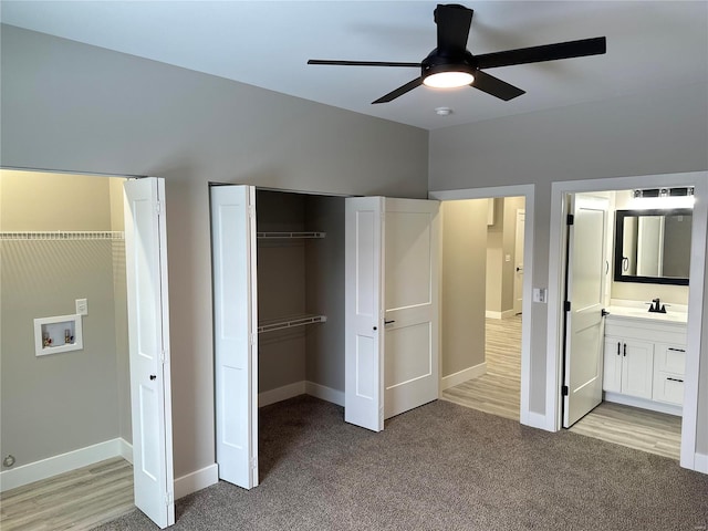 344 Rolling Knoll Rd, Washington, MO 63090 - unfurnished bedroom featuring light colored carpet, baseboards, connected bathroom, and a ceiling fan