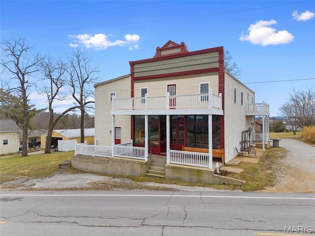 16683 Mill Rd, Marthasville, MO 63357 - townhome / multi-family property with a balcony and a porch