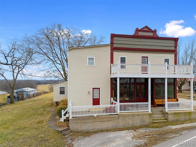 16683 Mill Rd, Marthasville, MO 63357 - view of front of home with a balcony, a front lawn, and a sunroom