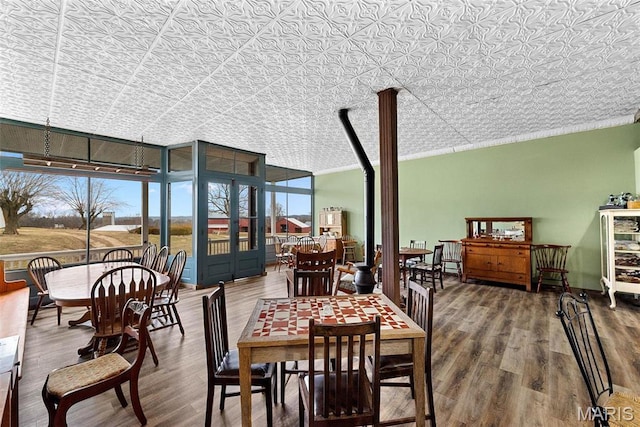 16683 Mill Rd, Marthasville, MO 63357 - dining space featuring wood finished floors, an ornate ceiling, and crown molding