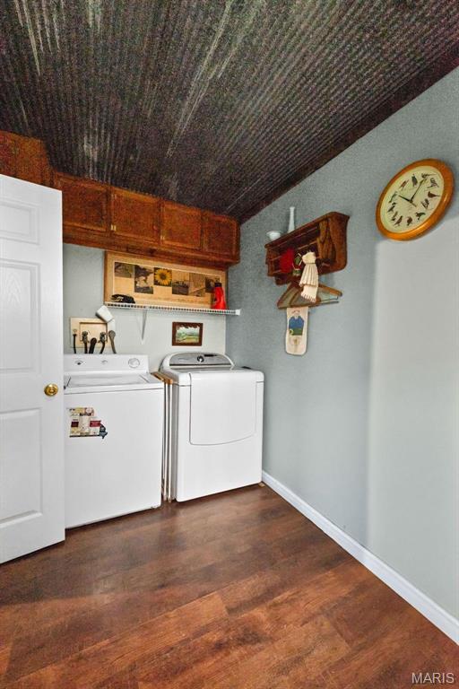 16683 Mill Rd, Marthasville, MO 63357 - laundry area with washer and clothes dryer and dark wood finished floors