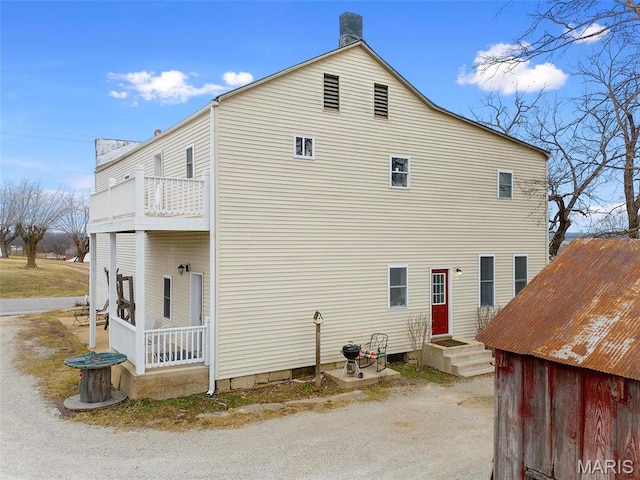 16683 Mill Rd, Marthasville, MO 63357 - view of side of property with a balcony and a chimney