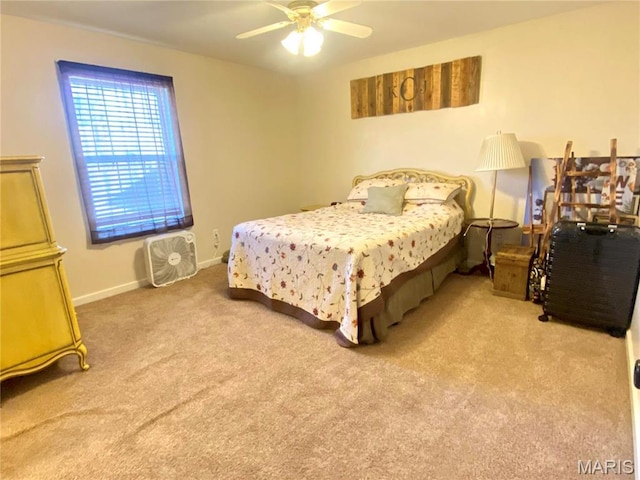 914 Pine St, Sikeston, MO 63801 - carpeted bedroom with baseboards and a ceiling fan