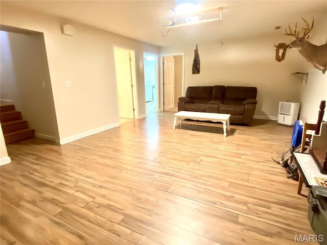 914 Pine St, Sikeston, MO 63801 - living room featuring light wood-style flooring, stairway, and baseboards