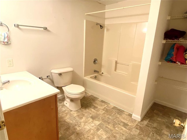 914 Pine St, Sikeston, MO 63801 - full bathroom featuring toilet, vanity, tub / shower combination, and baseboards