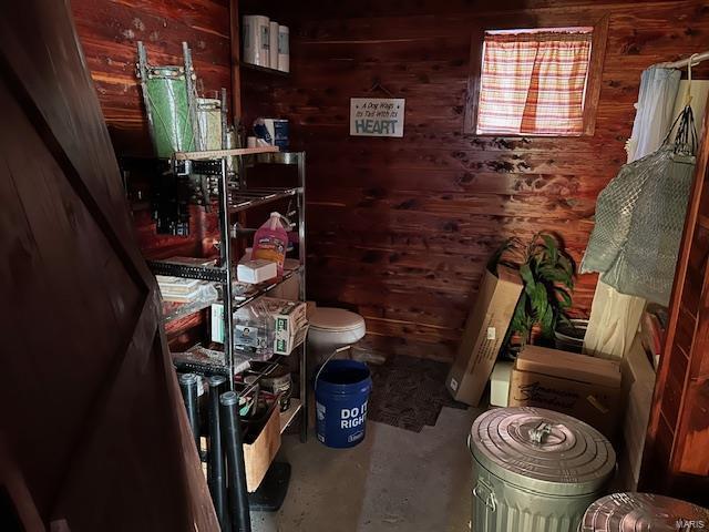 731 Buffalo Dr, Bismarck, MO 63624 - bathroom with wooden walls, concrete floors, and toilet