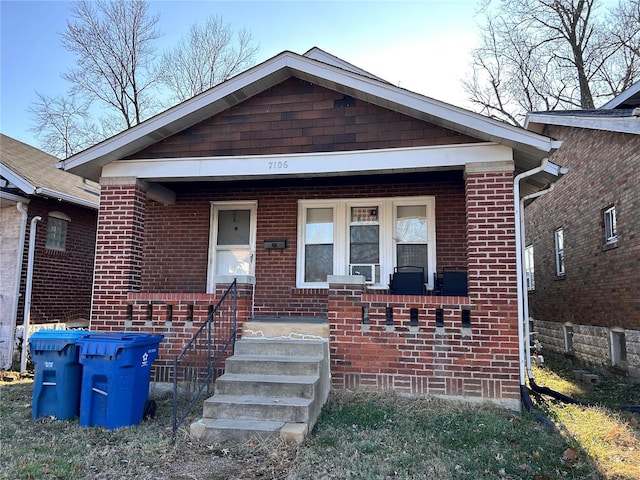 7106 Greenway Ave, Saint Louis, MO 63121 - view of front of home featuring brick siding and covered porch