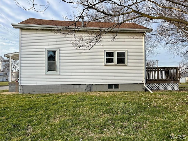 209 Mcgill St, Jerseyville, IL 62052 - view of property exterior with a yard, a wooden deck, and a shingled roof