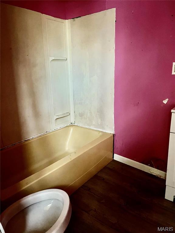 209 Mcgill St, Jerseyville, IL 62052 - full bath featuring wood finished floors, toilet, and baseboards