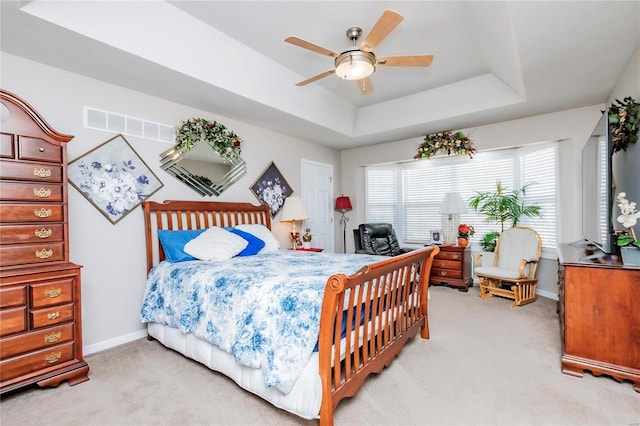 213 Kimberly Ct, Washington, MO 63090 - bedroom featuring light colored carpet, a tray ceiling, baseboards, and ceiling fan