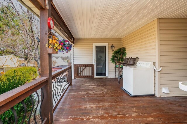 213 Kimberly Ct, Washington, MO 63090 - wooden deck featuring washer / dryer