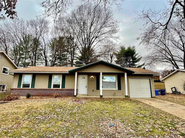 12065 El Camara Dr, Florissant, MO 63033 - single story home with a garage, concrete driveway, brick siding, and a front lawn