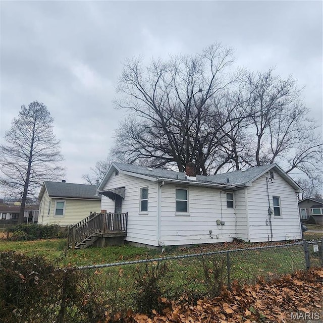 7120 Bancroft Ave, Saint Louis, MO 63109 - rear view of house with a fenced backyard and a chimney