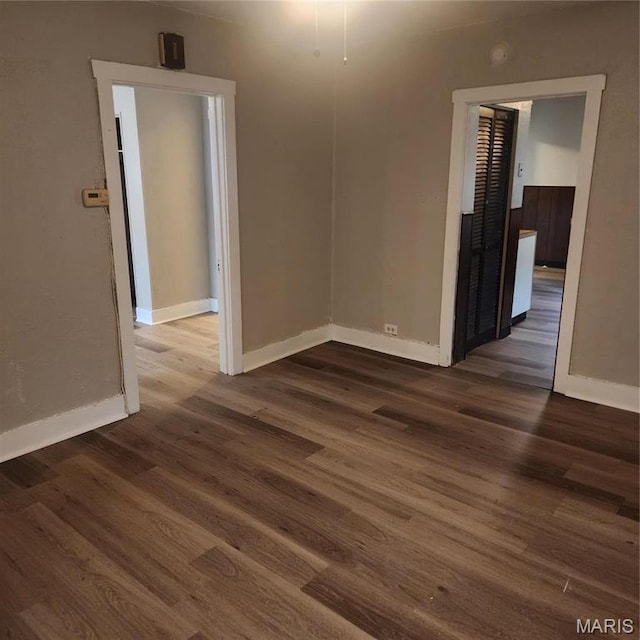 7120 Bancroft Ave, Saint Louis, MO 63109 - empty room featuring baseboards and wood finished floors