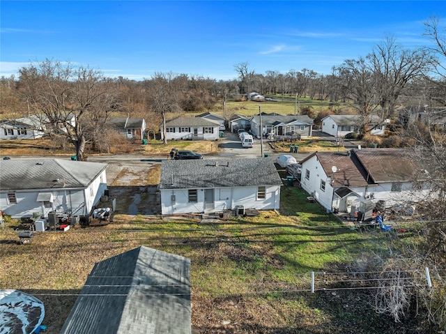 aerial perspective of suburban area featuring a tree filled landscape