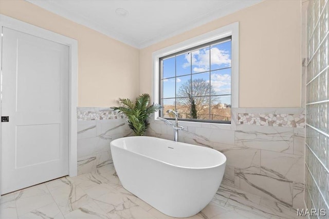 1824 Topping Rd, Saint Louis, MO 63131 - full bathroom featuring tile walls, a freestanding tub, marble finish flooring, wainscoting, and ornamental molding